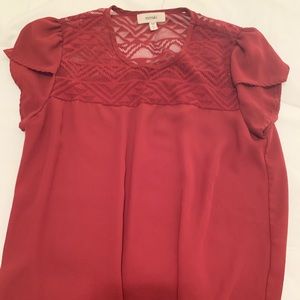 Burgundy shirt, lacey shoulders, full shirt